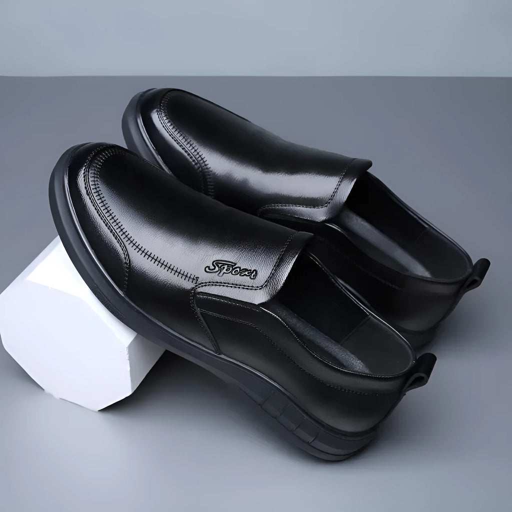 Men's black casual leather shoes with non-slip soft sole and round toe on a white background