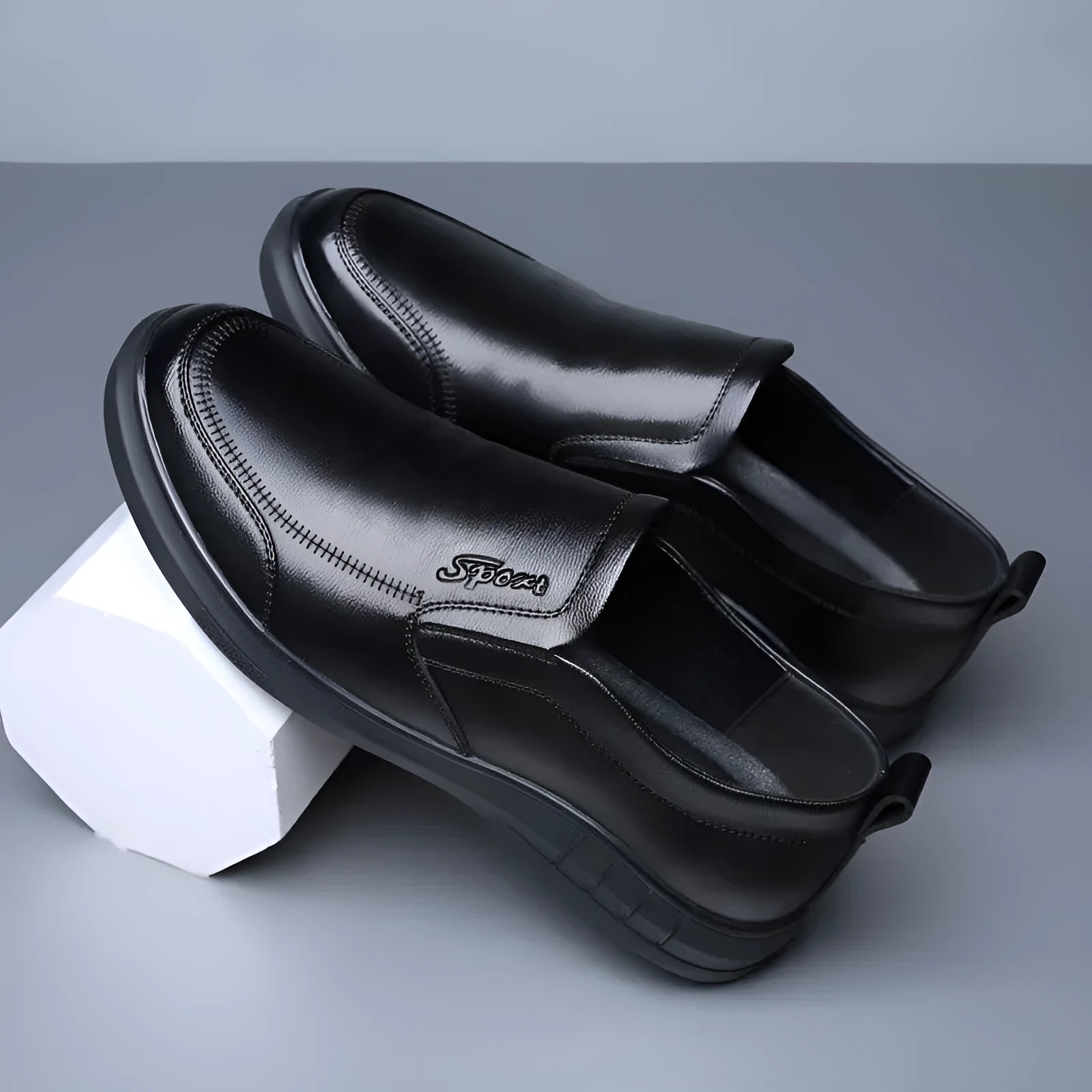 Men's black casual leather shoes with non-slip soft sole and round toe on a white background