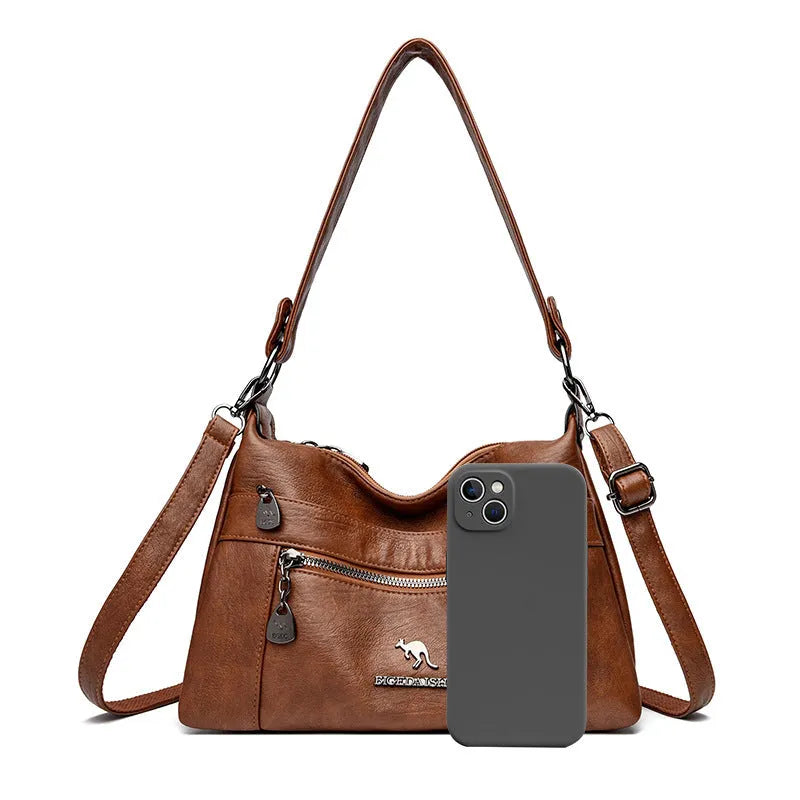 Genuine leather double-sided kangaroo crossbody bag in black with belt decoration and soft sheepskin finish.