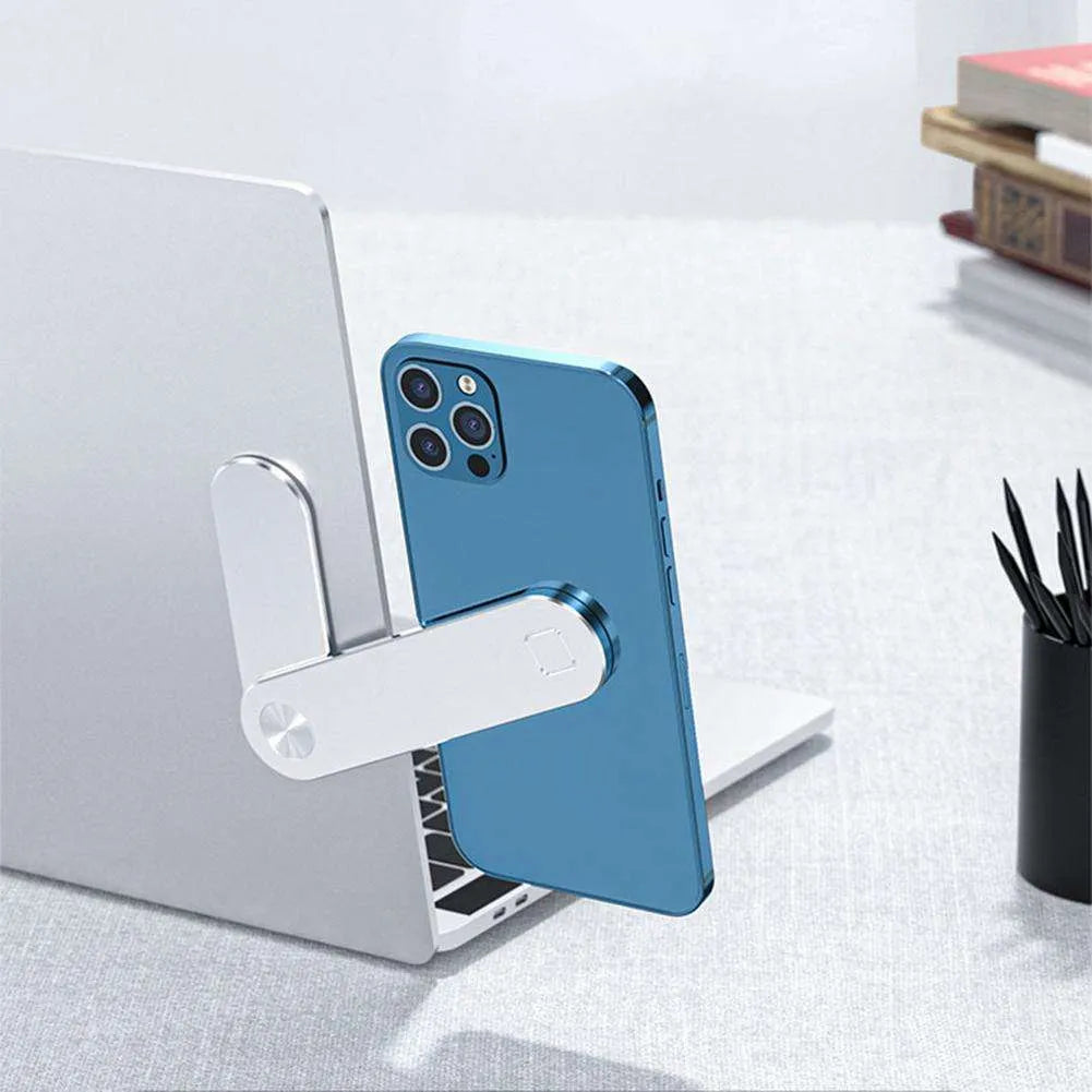 Black magnetic laptop phone holder clip attached to a monitor with a smartphone mounted.