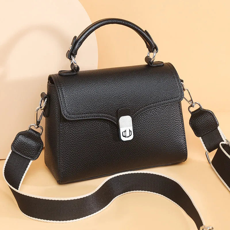 Genuine leather oval cross-body bag 21x18x9cm with sandwich pocket, shown in white, black, khaki and blue