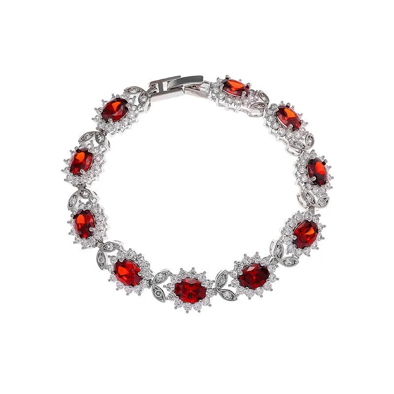 Simple electroplated alloy bracelet for women with inlaid zircon stone in one of nine colour options including ruby, emerald, and black onyx.