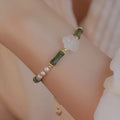 Chinese style olivine bamboo joint bracelet with Hetian jade and copper shell pearls on wrist