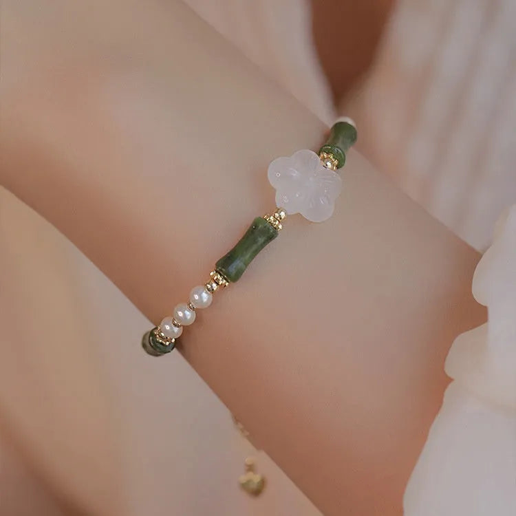 Chinese style olivine bamboo joint bracelet with Hetian jade and copper shell pearls on wrist