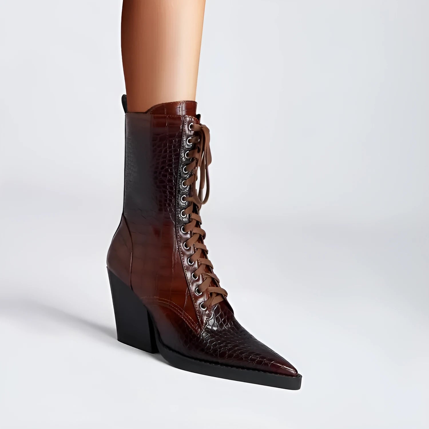 Dark brown retro pointed toe boots with a chunky heel and lace detail, side zipper visible.