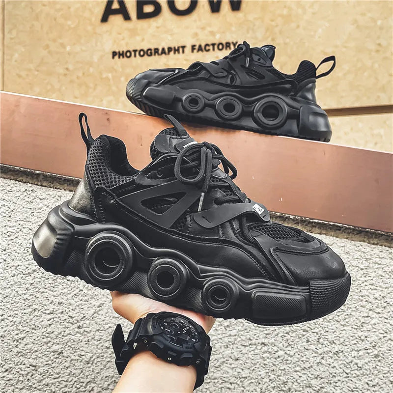 Men's black mesh sneakers with thick rubber soles and round toe design