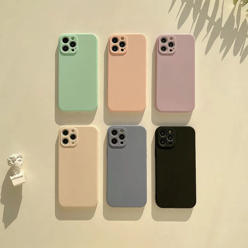 Frosted matte TPU phone back cover case for iPhone 14 in slate blue colour on a table.