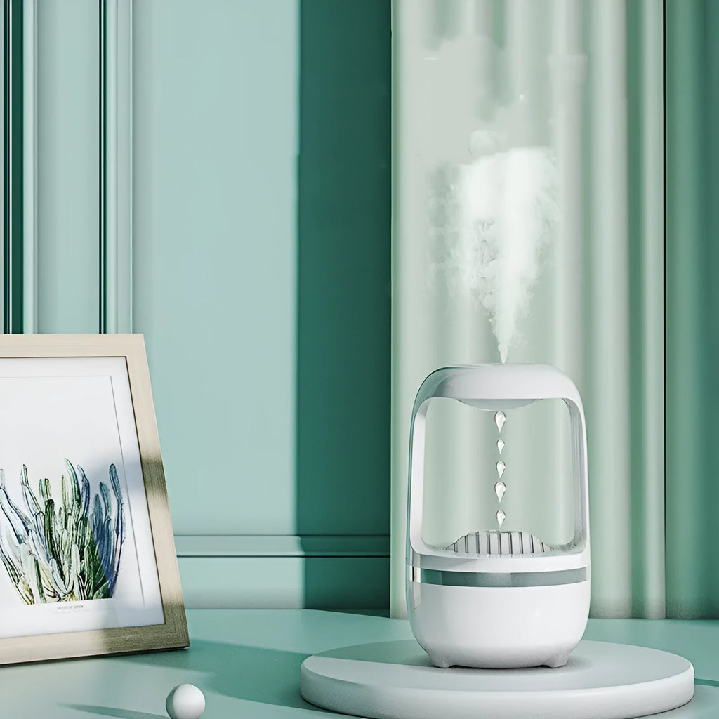 Black plastic anti-gravity water drop humidifier with USB cable, round shape, atmosphere lamp on desk