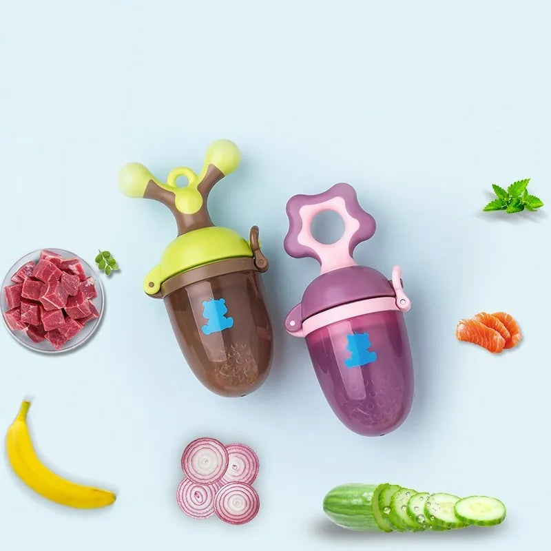 Green and purple silicone baby teether with textured chewing surfaces and a central handle.