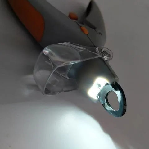 Yellow and grey pet nail trimmer clipper with LED light and magnifying glass on white background