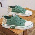 Men's low-top casual canvas shoes in blue colour with round toe and front lace-up design
