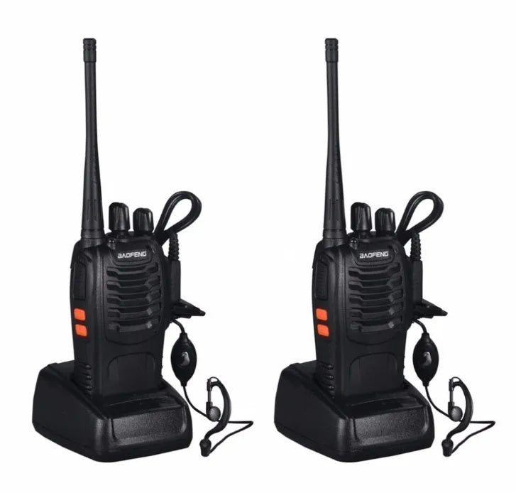 Black BF-888S walkie talkie with antenna and belt clip placed on dark surface