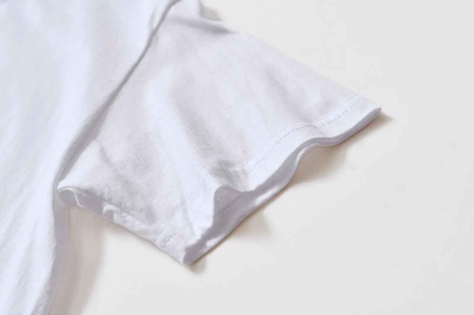 White cotton overalls with pattern design, short sleeves and round neckline for teenage summer wear