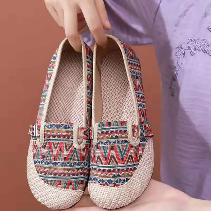 Women's ethnic style cloth shoes with flat heel, colour stitching, and shallow mouth opening
