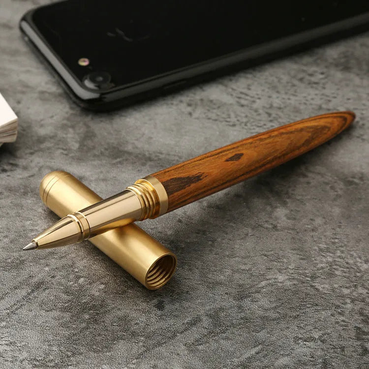 Brass and solid wood signature pen showing wood grain and metal details
