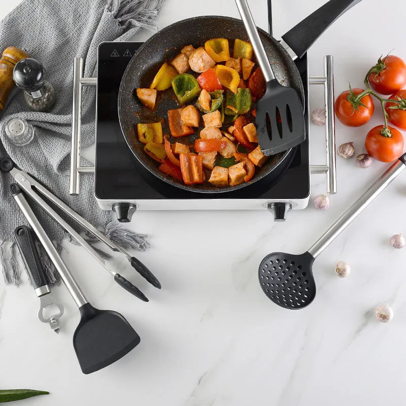 Black silicone spatula and spoon set with stainless steel handles containing 16 kitchen utensils