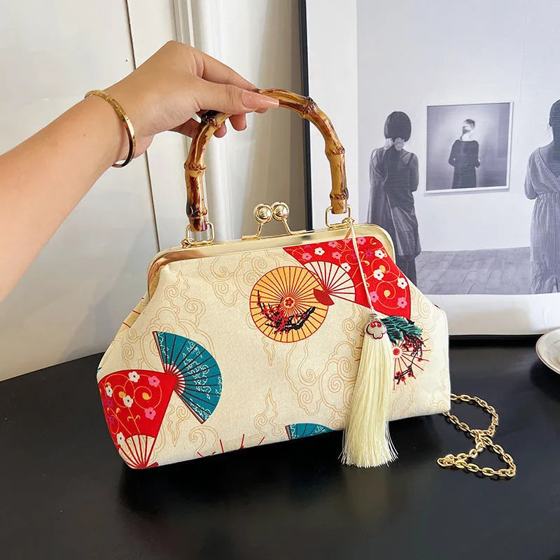Canvas shell shape crossbody bag with ethnic embroidery, 27cm x 17cm x 7cm, available in black