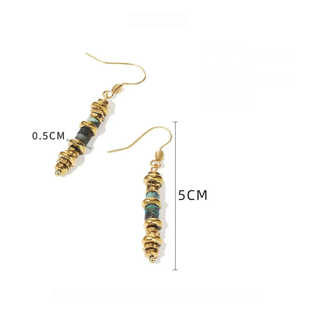 Geometric shaped titanium steel dangle earrings with a retro design on a white background.