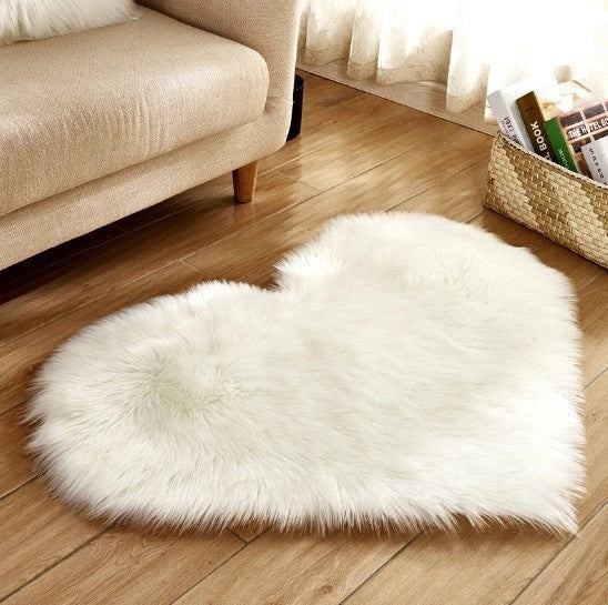 Soft and plush heart-shaped rug in various colors, perfect for cozy home decor