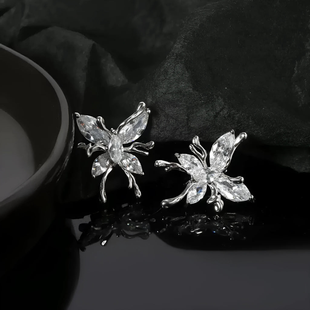 Pair of copper butterfly earphone clips with diamond inlay in a small fragrance style.