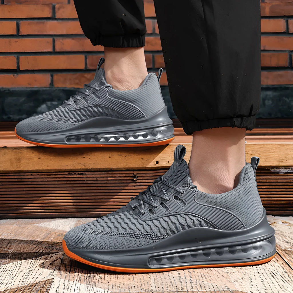 Men's low-top mesh sneaker in black with white sole and lace-up front.