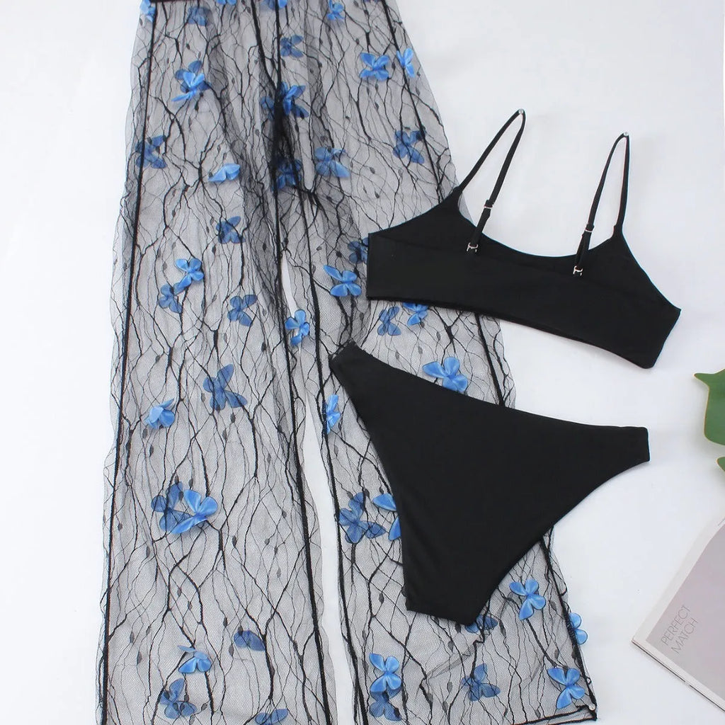 Women's black transparent butterfly pattern bikini three-piece set, showing top, underwear, and pants.