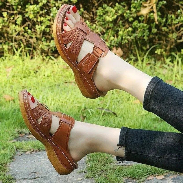 Women's red peep toe wedge sandals with a Velcro strap and hollow wedge heel.