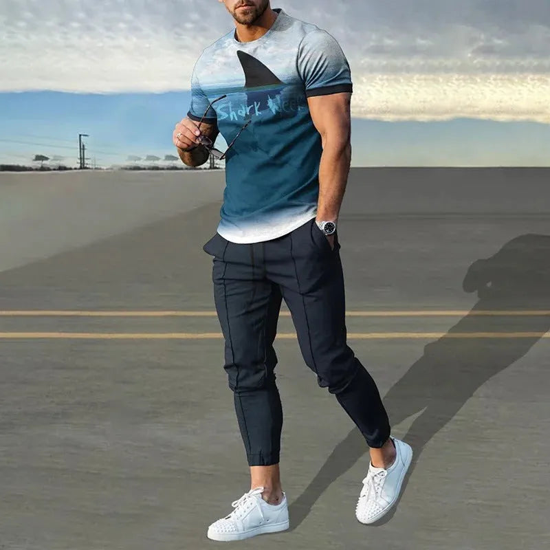 Man wearing a short-sleeved printed round neck T-shirt and matching trousers from a cotton-like polyester suit.