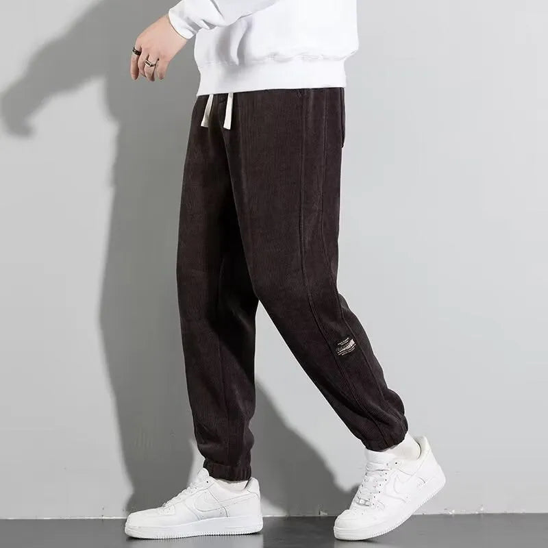 Men's loose straight drapey sweatpants in dark gray with drawstring waist and cotton blend fabric