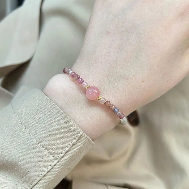 Pink crystal women's alloy bracelet with geometric electroplated charms including mermaid, lily, and cat head designs.