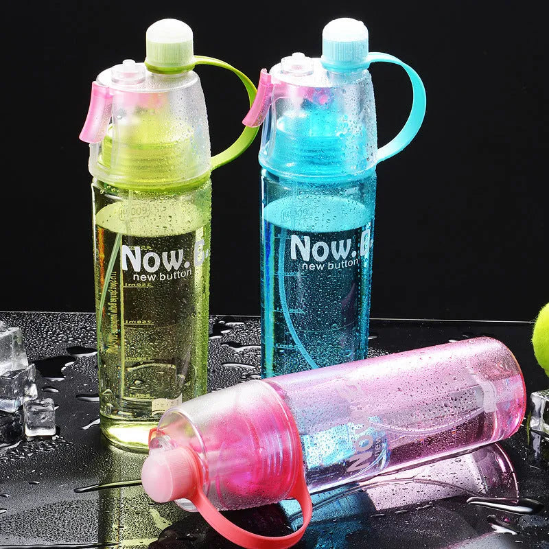 Green portable outdoor sports mist spray cup with handle, transparent scale, and spray mouth.