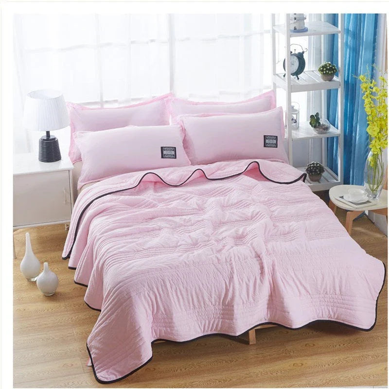 Lightweight, breathable cooling comforter in various colors and sizes for comfortable summer sleep