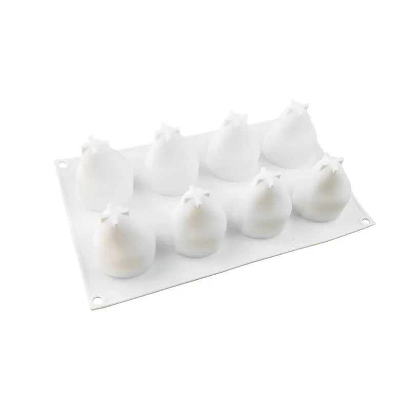 Flexible silicone baking mould with six cavities shaped like pine cones, pineapples, and pears.