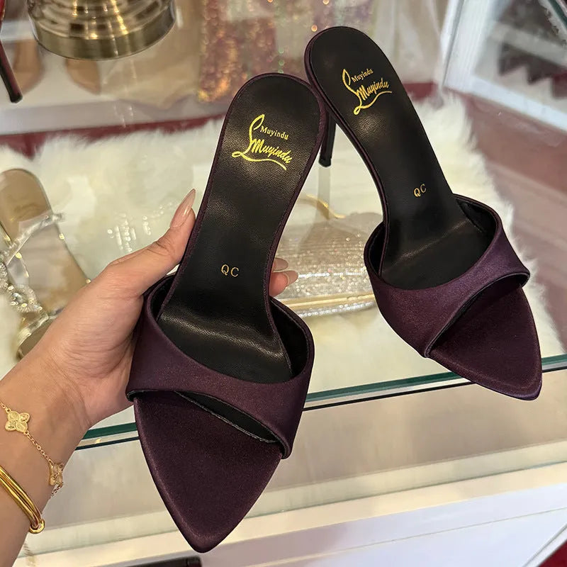 Women's black patent leather stiletto sandals with 8cm heel, pointed toe, and ankle strap