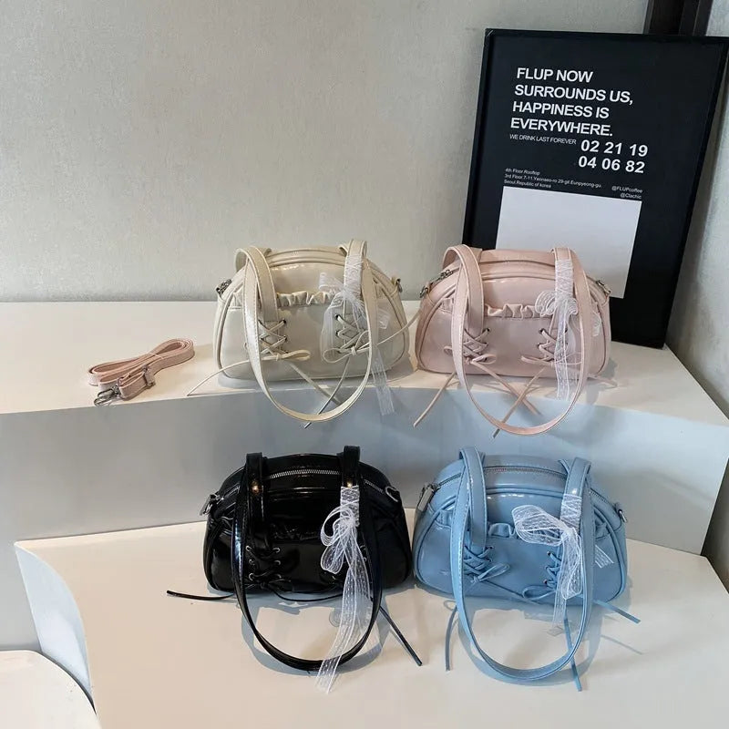Women's casual PU shoulder handbag with a large bandage bow detail and phone compartment.