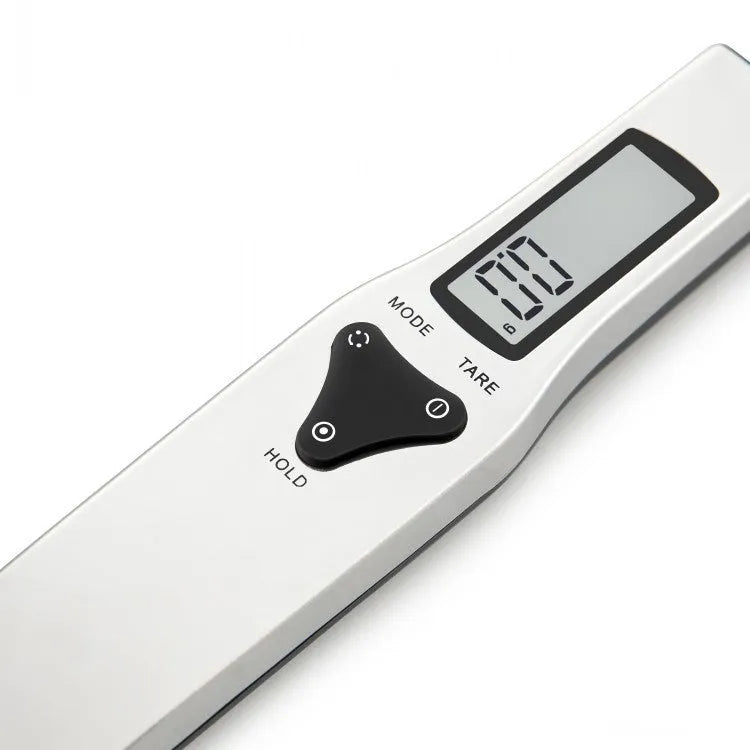 Digital kitchen measuring spoon with LCD screen showing weight measurement