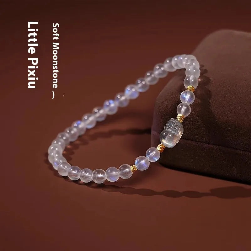 Moonstone women's bracelet with hand-ground beads and animal zodiac charms in fashion blue light colour
