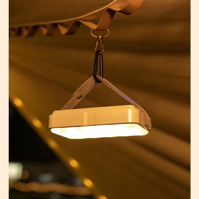 Outdoor waterproof tent camp light with 10000mAh battery, IP63 rating, dual warm and white LED sets, and included hanging accessories.