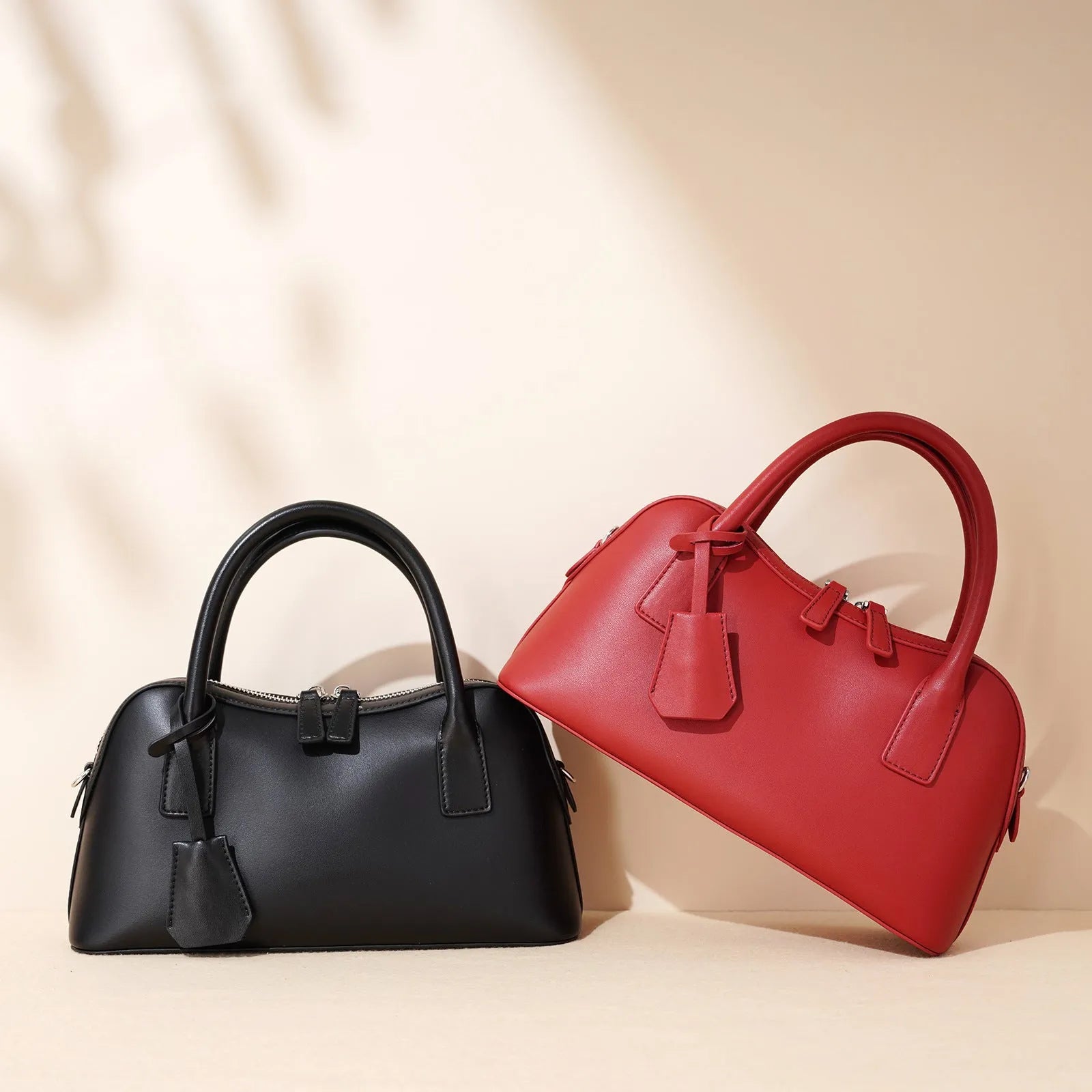 Red urban simplicity messenger bag in pillow shape with double shoulder straps and cowhide finish