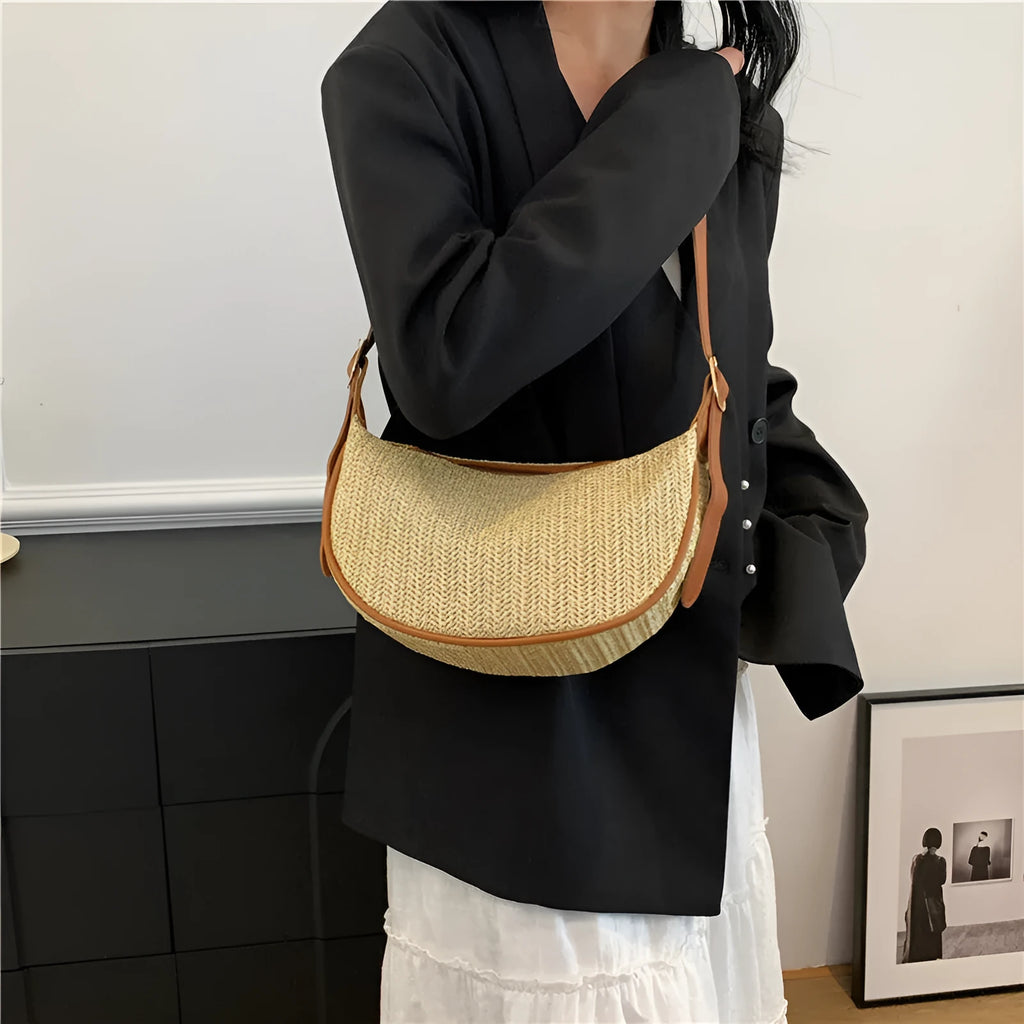 Women's woven straw crossbody bag showing knitted pattern and internal organisation compartments