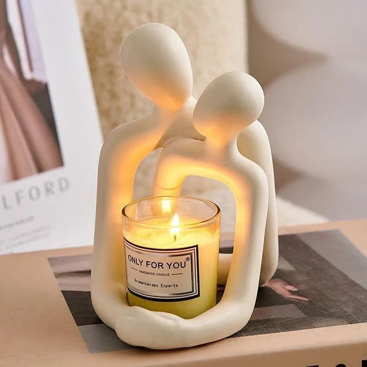 Modern simplicity style resin couple statue in milky white or gold finish.