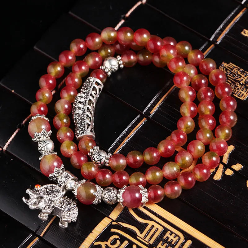 Handmade natural watermelon crystal Chinese knot bracelet in geometric elephant style.