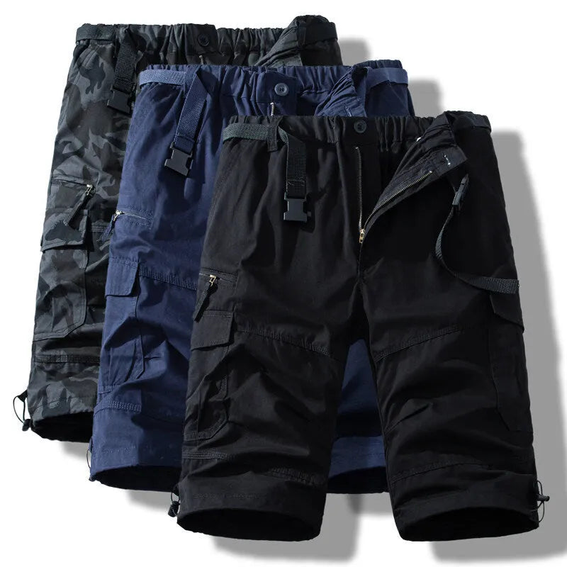 Man wearing thin cotton cropped overalls in army green, showing the relaxed summer fit.