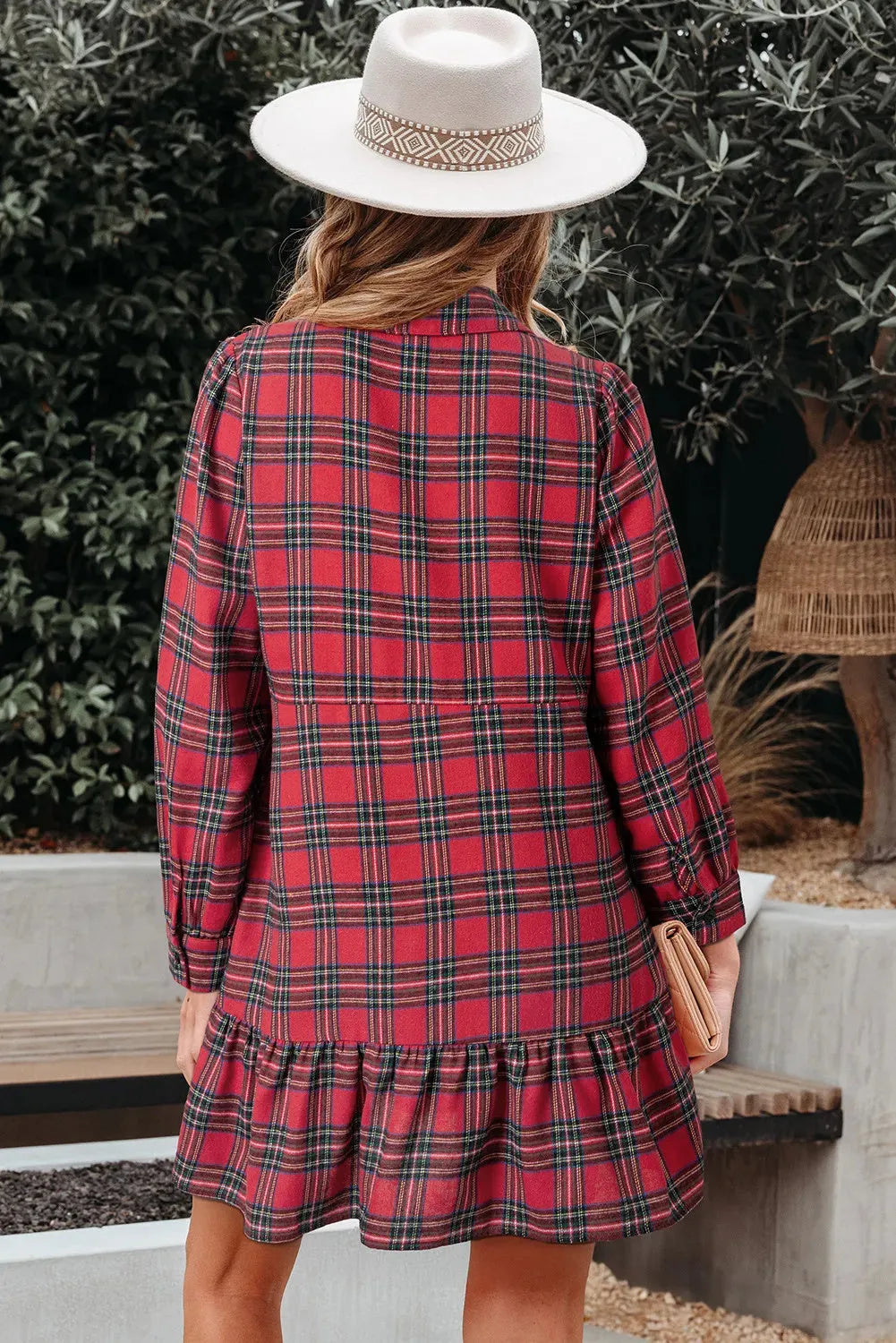 Red plaid women's mini dress with shirt collar, long sleeves, half-button front, and ruffle hem.