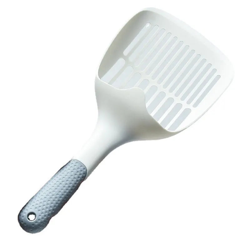 White plastic cat litter scoop sitting in its matching storage base.