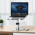 Silver adjustable car laptop stand with aluminum alloy frame and non-slip silicone pads.