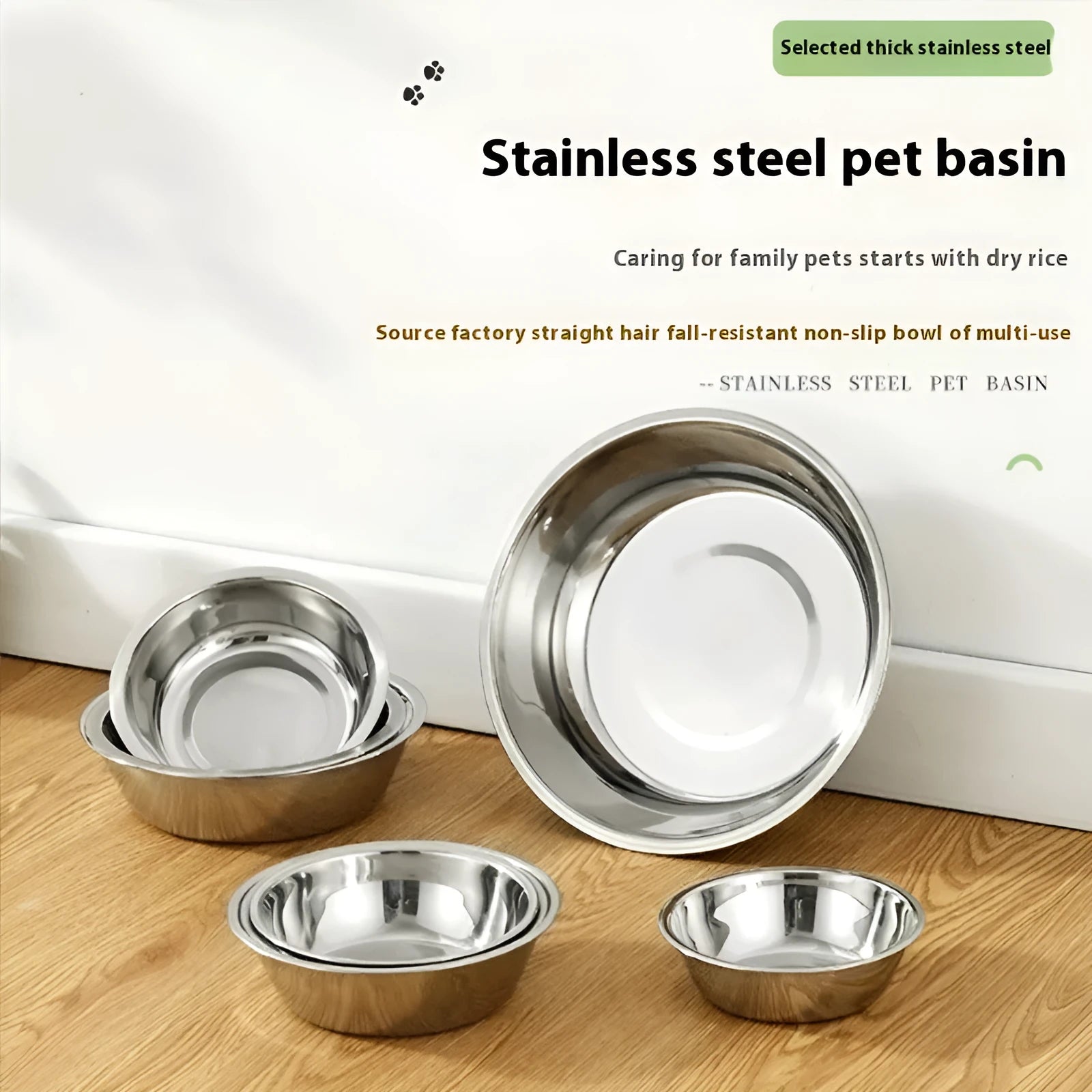 Stainless steel pet food bowl with non-slip base on a kitchen floor