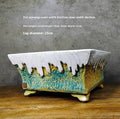 White glazed stoneware flowerpot from Lingnan Shiwan with smooth ceramic finish on neutral background