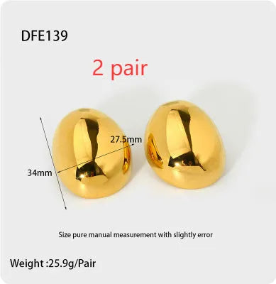 Geometric stainless steel ear studs with a gold electroplated finish and exaggerated glazed surface.
