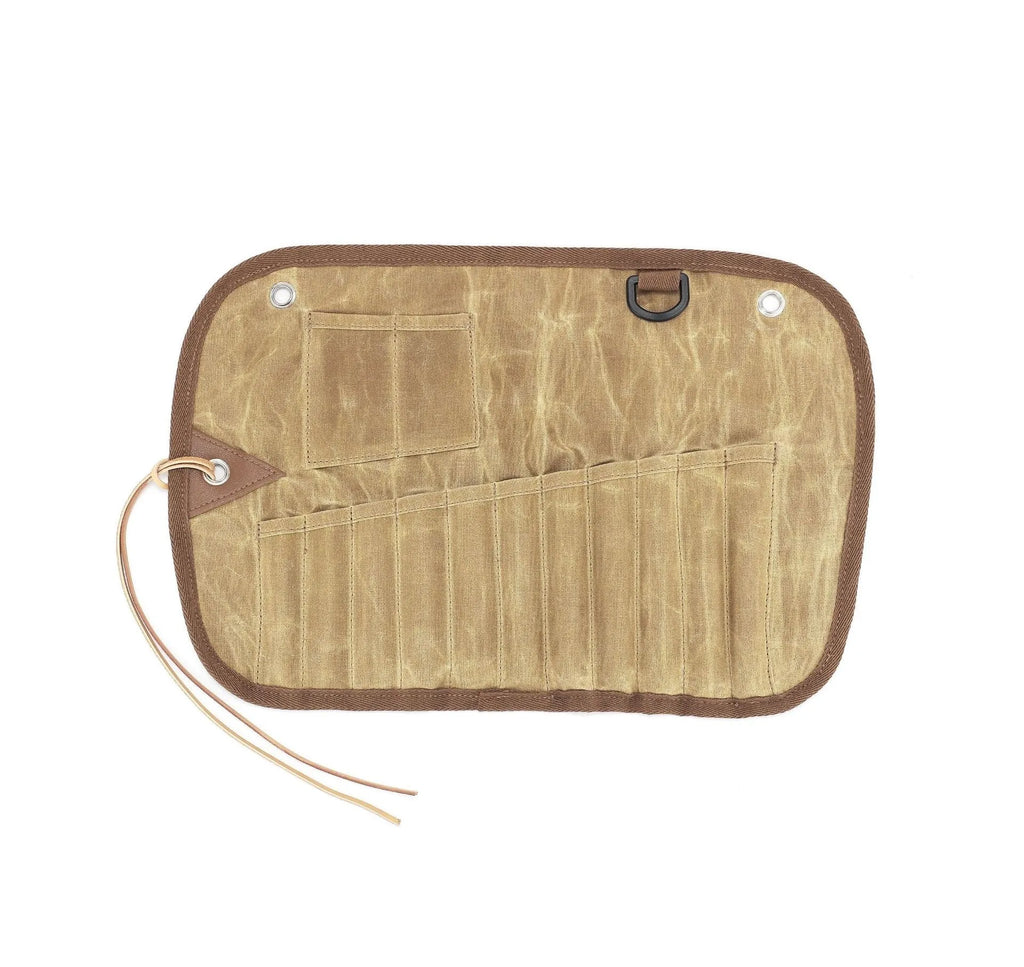 Waxed canvas portable storage bag containing a wooden handle knife, fork, spoon, butter knife, and chopsticks for outdoor dining.